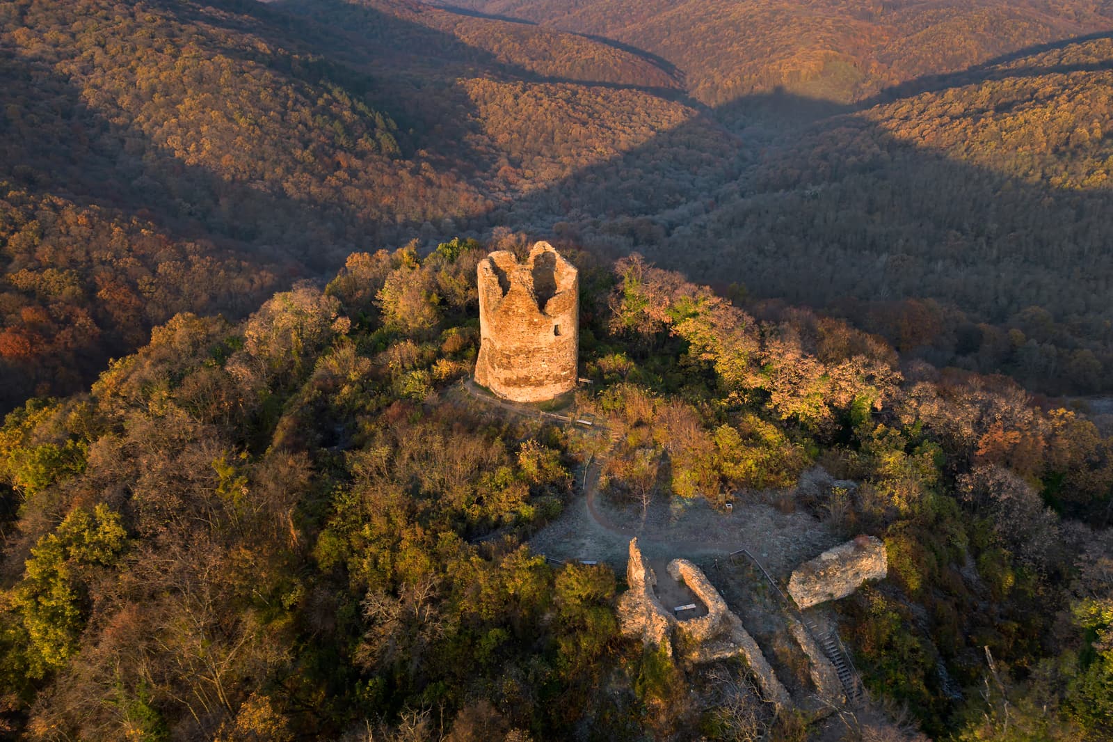 The medieval Vrdnik Tower rising above the forest of Fruška Gora